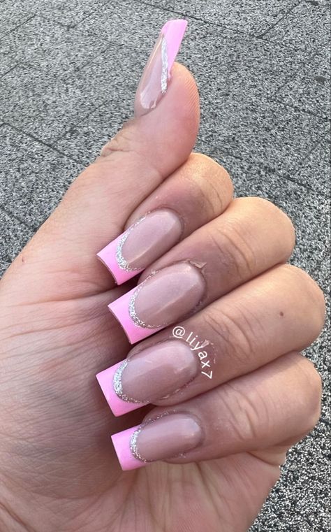 Pink tip acrylics with silver outline Pink French Tips With Silver Outline, Pink French Tip With Silver Line, Hot Pink And Silver Nails, Pink And Silver Nail Designs, Pink And Silver Nails, Pink Nails With Glitter, Tip Acrylics, Sweet 16 Nails, Silver Acrylic Nails