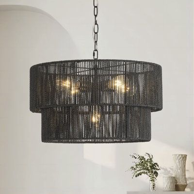 This 21.9 inch 5-light rattan chandelier showcases a 2 tiered woven shade. It is using natural handmade rope paper, environmental protection, health, odorless suitable for decoration warm home. The height can be adjusted by the chain, Compatible with sloping ceiling suspension. It is widely used in entryways, kitchen islands, dinging room and so on. Finish: Black | Bay Isle Home™ 5-Lights Hand-Woven Rattan Pendant Light in Black | 11.81 H x 21.85 W in | Wayfair Kitchen Dining Room Lighting, Black Light Fixtures Dining Room, Black Rattan Chandelier, Black Wicker Light Fixture, Black Rattan Pendant Light Kitchen, Black Woven Pendant Light, Boho Light Fixture, Cool Light Fixtures, Farmhouse Dining Room Lighting