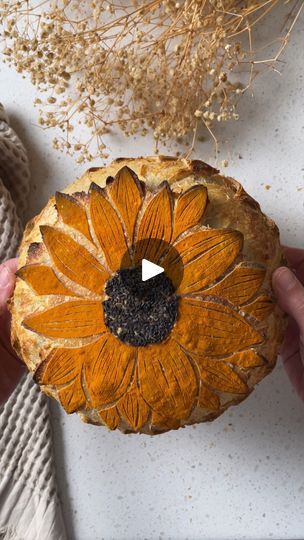 683K views · 6.8K reactions | 🌻Sunflower Sourdough Score🌻

This elegant, yet simple score by Rachel (@sourdough_enzo) is a perfect way to elevate your next sourdough loaf for summer! 

Use a circle cookie cutter in the center and fill it with black sesame seeds. Dust the bread with turmeric powder and score the petals. Remember to do the expansion score at 7 minutes, so the petals really lift off the loaf.

#sourdoughbread #scoring #scoringbread #scoringsourdough #sunflowerscore | CBC Life | Bertholet · Sunflower Sourdough Score, Bread Scoring, Sourdough Loaf, Homemade Sourdough Bread, Bread Art, Amazing Food Art, Black Sesame Seeds, Healthy Bread, Sourdough Baking