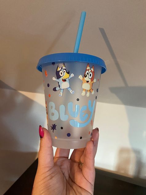 16oz clear PLASTIC kids cup with a permanent UV design. Makes the perfect gift for any occasion! Kids Birthday, best friends, etc.  **Listing includes a blue plastic straw and snap-on blue plastic lid. Please care with extra love! * These are NOT dishwasher safe * These are NOT microwave safe * Do not scrub * Do not soak Thank you for visiting my store! Bluey Bingo Bandit Chilli Chili | Kids Cup | Kids Plastic Cup Iced Coffee, Wine, Beer Cup Tumbler | Beer Can Glass | Home Decor | Kitchen items Personalized Kids Cups, Birthday Goodie Bags, Bluey Bingo, Baby Birthday Themes, Coffee Decor Kitchen, Coffee Glasses, Toddler Cup, Glass Home Decor, Beer Cup