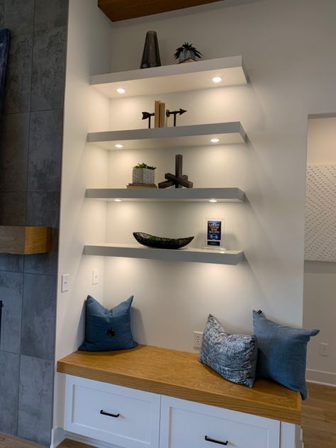 Floating Bookshelves With Lights, Floating Shelves With Lamp, Four Floating Shelves Arrangement, Floating White Shelves Bedroom, Under Bookshelf Lighting, Theater Room Floating Shelves, Wall Length Floating Shelves, Floating Shelves Above Chest Of Drawers, Art On Floating Shelves