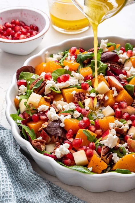 This simple winter salad combines spring mix, roasted butternut squash, pomegranate, pecans, apple and feta cheese all tossed in a white balsamic vinaigrette. Butternut Squash Pomegranate, White Balsamic Vinaigrette, Winter Salad Recipes, Cheese All, Turkey Pasta, White Balsamic, Salad Sauce, Spring Mix, Winter Salad