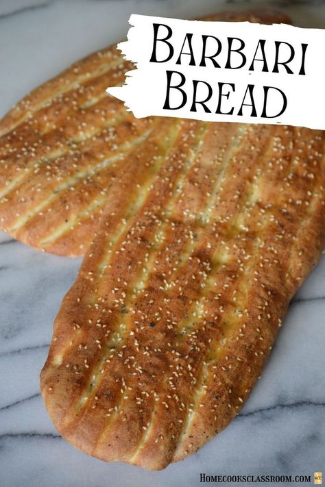 Barbari bread is a traditional type of Persian bread that anyone can make at home. It consists of a lightly leavened dought that is stretched into a rectangle shape and pressed with vertical ridges. This is then brushed with a glaze and sprinkled with sesame seed. It's then placed into a hot oven until golden brown. The end result is something like fluffy focaccia and goes great with practically any meal. Persian Barbari Bread, Persian Flatbread, Persian Breakfast, Barbari Bread, Airy Interior, Iranian Recipes, Breads & Buns, Flatbread Recipes, Flat Bread