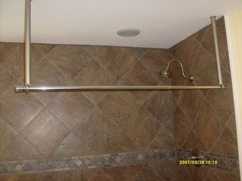 The hanging shower rod is a neat and cheap alternative for a different look to your bath. The rod also eliminates the need for two walls for support. This system works great on free standing tubs and areas where privacy is needed, indoors or out.... Ceiling Mounted Shower Curtain, Ceiling Shower Curtain, Clawfoot Tub Shower Curtain, Ceiling Mount Curtain Rods, Corner Shower Curtain Rod, Clawfoot Tub Shower, Curtain Hangers, Slanted Ceiling, Cute Curtains