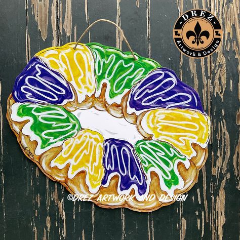 "This King Cake Door Hanger is the perfect addition to your Mardi Gras decorations  It is approximately 15x 24\".   It is a UV print made from my original artwork designed by me It is made of PVC making it extremely durable, waterproof and lightweight.  This would be a great Christmas present for someone on your list being Mardi Gras season is right after Christmas! If wanting to SAVE ON SHIPPING and thinking of ordering 2 pieces from all of my listings, we can put 2 pieces inside one box to low Mardi Gras Wood Signs, Birthday Door Hanger, Mardi Gras Art, Mardi Gras Door Hanger, Burlap Door Hangings, Mardi Grad, Mardi Gras Decor, King Cake Baby, Mardi Gras Crafts