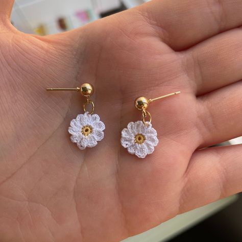 These micro crochet daisy earrings are each handmade to order and are the perfect accessory to any outfit.  Crafted from 100% cotton yarn, these earrings are made with white and yellow thread. The earrings posts are either gold plated or 304 stainless steel and both are nickel free and lead free (The silver earring posts are slightly smaller than the gold posts). Please allow 3-4 days for the earrings to be dispatched.  Note: do not get these earrings wet or wear them in the shower *Kindly be aw Micro Crochet Earrings, Crochet Daisy Flower, Contemporary Handmade Jewelry, Crochet Necklace Pattern, Micro Crochet, Jewelry Making Classes, Crochet Tutorial Pattern, Crochet Jewelry Patterns, Crochet Earrings Pattern