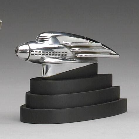 rare 1936 'streamliner' Hupmobile mascot designed by Raymond Loewy Streamlining Design, Raymond Loewy Design, Robot Project, Streamline Art, Car Mascot, Deco Statue, Car Hood Ornaments, Raymond Loewy, Rocking Horses