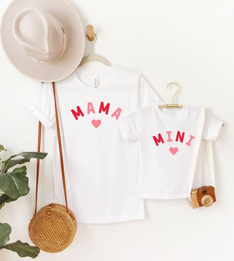 Mama + Mini Valentine's Day Shirts. Matchy match for Moms and kiddos on Valentine's Day. THE DETAILS: * Made from 100% cotton * Super soft, lightweight and comfy * Printed with eco-friendly inks FIND US ON SOCIAL MEDIA: + Instagram: @milkandcookiesart + Facebook: @milkandcookiesart PRODUCTION & SHIPPING: Your item is custom printed to order within 2-7 business days. See your shipping speed at checkout. Mommy And Me Tshirts, Mama And Mini Shirts, Mini Shirts, Mom And Me Shirts, Kids Valentines Day, Father Son Matching Shirts, Cute Family Photos, Mama And Mini, Christmas Shirts For Kids