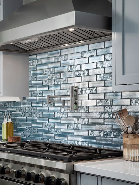 Characterized by its metallic effect, our subway glass tile exudes sophistication and charm, creating a tranquil and deep ambiance. Blue Kitchen Subway Tile, Glass Backsplash Tile, Blue Backsplash Kitchen, Glass Backsplash Kitchen, Backsplash With White Cabinets, Mosaic Tile Backsplash Kitchen, Lake House Kitchen, Blue Backsplash, Subway Tile Kitchen