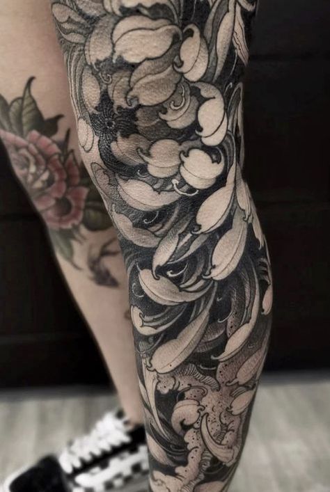 Discover the rich symbolism and Japanese history behind chrysanthemum tattoos. From delicate blooms to bold statements, find your perfect design here. Asian Flower Tattoo, Black Chrysanthemum Tattoo, Chrysanthemum Tattoos, Crisantemo Tattoo, Black Skull Tattoo, Chrysanthemum Tattoo, Sak Yant Tattoo, Blackout Tattoo, Theme Tattoo