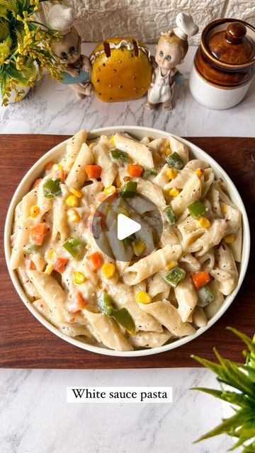 Divya on Instagram: "White sauce pasta recipe 😍😍
Save this for later ❤️. 

Ingredients- 
1. Pasta- 1 cup 
2. Oil - 1 tbsp 
3. Garlic- 3-4 
4. Onion- 1 
5. Capsicum- 1/3 cup 
6. Carrot - 1/3 cup 
7. Boiled sweet corn- 1/3 cup 
8. Butter- 2 tbs
9. All purpose flour (Maida) - 2 tsp 
10. Milk - 2 cup 
11. Cheese - 1/2 cup 
12. Chilli flakes- 1 tsp 
13. Oregano- 1 tsp 
14. Black pepper powder- 1 tsp 
15. Salt - 1 tbsp 

Do try this recipe and let me know if you liked it or not 😍😍. 

Follow @cookingdiaryathome 
For more such amazing content ❤️. 

❌NO REPOST ❌

[ Pasta recipe, white sauce pasta, cheese lover , quick snacks recipe, mac & cheese recipe, easy snacks, recipe video, Ranchi blogger] 

#reelinstagram #recipereel #pastalover #whitesaucepasta #pastarecipe #easyrecipe #quickrecipe #ran White Sauce Pasta Recipes Videos, Easy Indian Recipes Videos, Boil Sweet Corn, White Pasta Sauce Recipe, Pasta Recipes Video, White Sauce Pasta, Easy Indian Recipes, Quick Recipes Snacks, Mac Cheese Recipes