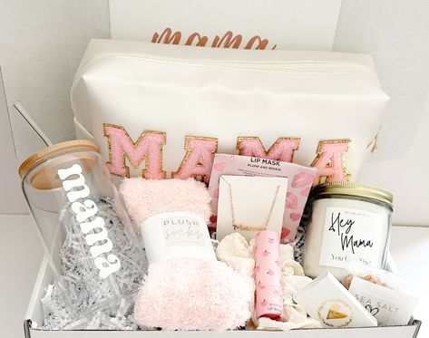 Are you looking for the perfect gift basket for that special woman in your life? Look no further our MAMA deluxe gift box.  This perfectly curated multi-purpose bag is the ideal gift for all the moms out there!  All our boxes are hand packed with the highest quality of comfort items and made specially for you. Want to change out items or make substitutions?  Let us know and we can make you a custom box.  GIFT BOX INCLUDES: ♥ 8oz "Hey Mama You Git This" jar candle with bamboo lid ♥ mini matchbox with gold heart detail ♥ moisturizing lip balm ♥ delicious sea salt caramels ♥ adorable elastic beaded bracelets with a gold heart charm. (4) ♥ MAMA multi-purpose toiletries/ makeup bag  ♥ MAMA gold tone necklace ♥ light weight solid scrunchie hair tie ♥ plush solid socks perfect for year round ♥  M Gifts For A New Mom Care Packages, Soon To Be Mom Gift Basket, Mama To Be Gift Basket, Gift Baskets For New Moms, Pregnancy Basket Care Packages, Christmas Basket For Mom, Post Partum Gifts Basket New Moms, Pregnancy Basket For Mom, Mommy To Be Gift Basket