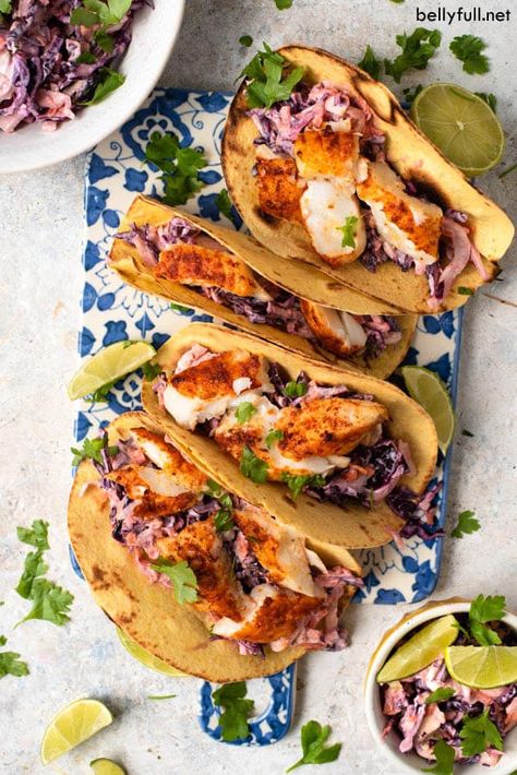 This Grilled Fish Taco recipe is made with cabbage slaw, a simple seasoning, and corn tortillas. Use whatever white fish you like (tilapia, cod, mahi mahi, or halibut) for this easy and delicious dish. #fishtacos #easyrecipe #seafood #summer Easy Fish Taco Recipe, Tacos Fish, Fried Fish Tacos, Fish Taco Sauce, Easy Fish Tacos, Grilled Fish Tacos, Grilled Fish Recipes, Grilled Taco, Fish Taco