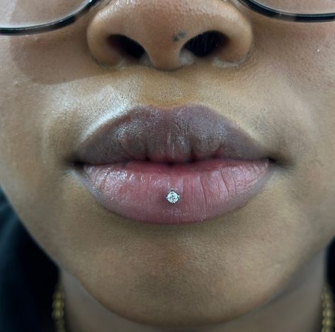 CAN'T STOP, WON'T STOP OBSESSING OVER THIS ASHLEY PIERCING! 😍  ASHLEY PIERCING BY @marcymods TITANIUM PRONG GEM FROM @invictus_bodyjewelry  Soho, Union Square, and Williamsburg  11AM-9PM 7 DAYS A/W🕘 WALK-INZ OR BOOK ONLINE..📕 TATTOOS & PIERCINGS, NO ATTITUDE, NO MISERABLE HOOPS TO JUMP THROUGH....🚫  WALK-INZ WELCOME OR BOOK ONLINE AT  ⚔️livebytheswordtattoo.com⚔️ . . . . #ashleypiercing #lippiercing #bodymod #piercing #soho #manhattan Ashley Piercing Aesthetic, Lip Piercing Black Women, Ashley Piercing Black Women, Lip Piercing Ashley, Ashley Piercing Jewelry, Ashley Lip Piercing, Piercings Facial, Piercing Aesthetic, Dimple Piercing