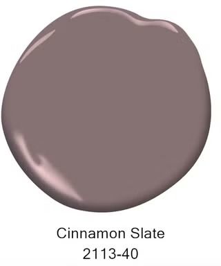 A glossy swatch of paint in a muted, warm beige-brown tone with the label Cinnamon Slate positioned below itThe design has a smooth, rounded shape that exemplifies the paint's texture and saturation 2025 Color Trends, Cinnamon Slate, Calming Paint Colors, Log Home Interior, Paint Inspo, Chicago House, Living Room Redo, Shine The Light, Best Indoor Plants