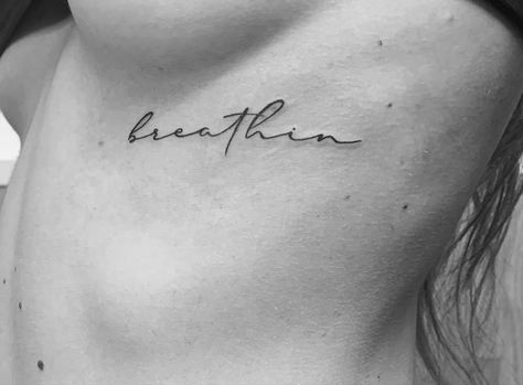 Ariana Grande Rib Tattoo, Breathin Tattoo Ariana Grande, Just Keep Breathing Tattoo, Keep Breathing Tattoo, Breathin Tattoo, Ariana Tattoos, Ariana Grande Tattoo Ideas, Inscription Tattoo, Divorce Healing