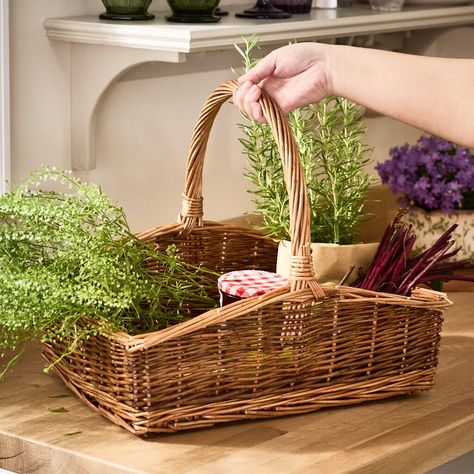 This traditional trug is woven from natural willow wicker that's double steamed and unpeeled for a vintage style look. The large basket features a curved carry handle, and the long, wide shape makes it a practical and stylish garden accessory or a rustic kitchen storage solution perhaps.Just the thing for gathering fresh produce and flowers, and displaying your foraged goods to bring some country style character to your home. not given Wicker Trug Basket, Rustic Kitchen Storage, Garden Trug, Chevron Door, Garden Bench Cushions, Kitchen Basket Storage, Style Character, Outdoor Side Tables, Garden Lanterns