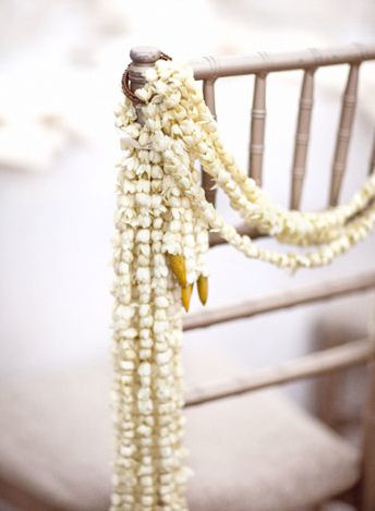 Strands of jasmine on chair to complement jasmine mandap Jasmine Wedding, Green Centerpieces, Enchanted Forest Wedding, Thai Wedding, Wedding Aisle Decorations, Jasmine Flower, Indian Wedding Ceremony, Bali Wedding, Traditional Indian Wedding