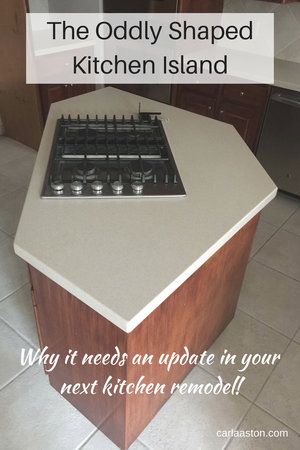 The Oddly Shaped Kitchen Island - Ready for an update in your kitchen remodel! Hexagon Island Kitchen, Diamond Shaped Kitchen Island, Kitchen With Diagonal Island, Kitchen Island Triangle Shape, Unusual Shaped Kitchen Islands, Odd Shaped Island Kitchen, Odd Shaped Kitchen Island Ideas, Unique Kitchen Island Shapes, Pill Shaped Island