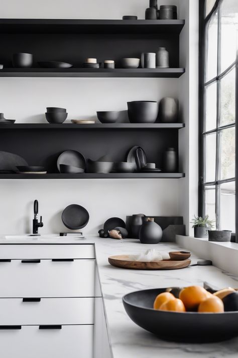 Minimalistic kitchen with black shelves holding various black ceramics and a countertop with a cutting board, oranges, and a potted plant near a large window. White Walls Black Shelves, Kitchen Floating Shelves Ideas, Black Pantry Shelves, Kitchen Shelving Styling, Black Shelves Kitchen, Kitchen Floating Shelves Decor Ideas, Kitchen Shelves Decor Ideas, Kitchen Shelves Decor, Shelves Decor Ideas