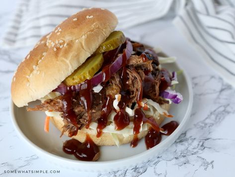 slow cooker bbq beef sandwich on a white plate ready to eat #beef #bbq Crockpot Sandwich Recipes, Crockpot Bbq Beef, Crock Pot Bbq Beef, Chuck Roast Crock Pot Recipes, Crock Pot Bbq, Slow Cooker Bbq Beef, Bbq Beef Sandwiches, Beef Sandwich Recipes, Pot Roast Crock Pot Recipes