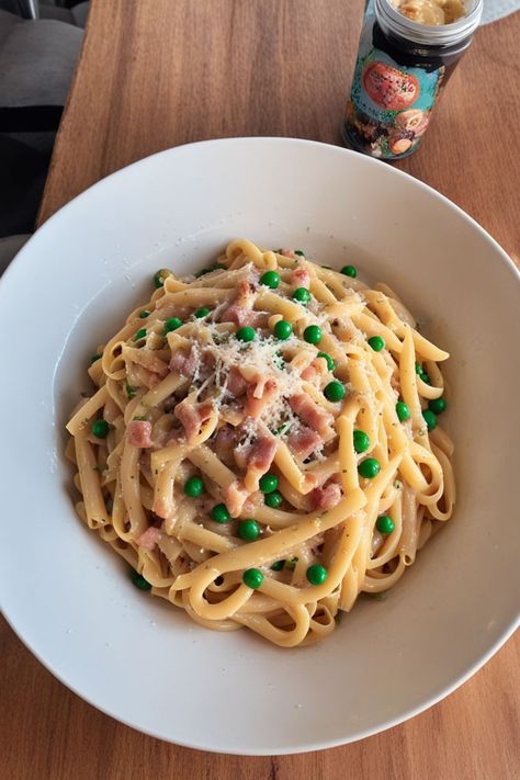 Pasta Carbonara with Peas Recipe

Ingredients

- 8 ounces spaghetti
- 1 cup frozen peas
- 4 ounces pancetta or guanciale, diced
- 2 large eggs
- 1 cup grated Parmesan cheese
- Salt and black pepper to taste
- Fresh parsley, chopped (for garnish)

Instructions

- Cook spaghetti according to package instructions in salted water. Add peas during the last 2 minutes of cooking; drain and reserve some pasta water. 
- In a large pan, cook pancetta over medium heat until crispy. In a bowl, whisk together eggs and Parmesan cheese until smooth. 

Full Recipe on... Peas And Pancetta Pasta, Pancetta Pasta Recipes, Pasta Carbonara With Peas, Carbonara With Peas, Carbonara Pasta Creamy, Spaghetti Dishes, Pancetta Pasta, Pasta With Peas, Boiling Pasta