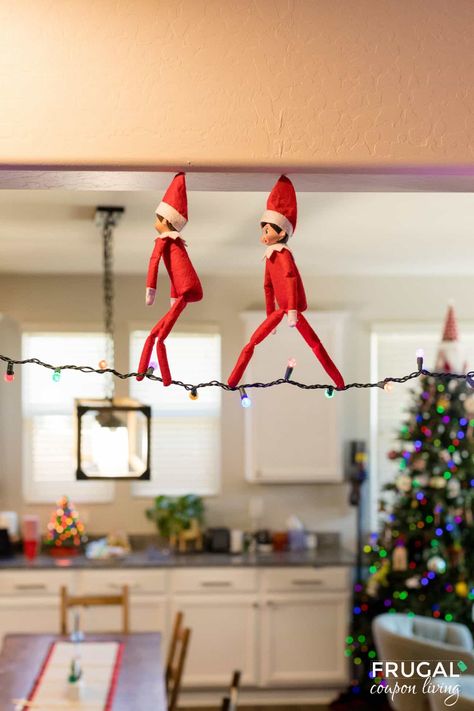 Get ready to take your Elf on the Shelf game to new heights with a whimsical and enchanting idea that will leave your kids wide-eyed and full of wonder. The Elf on the Shelf Tightrope Walker is not only a magical addition to your holiday traditions but also a setup that will have your little ones asking, "How did he do that?" Follow our step-by-step guide to create this festive and gravity-defying scene in your home. New Elf on the Shelf ideas daily plus free Elf on the Shelf printables. 2 Elves On The Shelf Arrival Ideas, Elf On The Shelf Plane Ideas, Spiderman And Elf On The Shelf, Elf On The Shelf And Friend Ideas, Elf Arrival Gift Ideas, Elf Couple Ideas, How To Retire Elf On The Shelf, How To Put Wire In Your Elf On The Shelf, 4 Elf On The Shelf Ideas