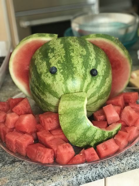 Carved watermelon elephant Animal Watermelon Carving, Safari Animal Food Ideas, Wild One Birthday Party Snacks, Jungle Theme Party Snacks, Zoo Safari Birthday Party, Watermelon Elephant Carving How To, Wild One Birthday Snacks Food Ideas, Safari Theme Birthday Food, Zoo Animal Food Ideas