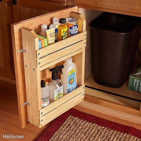 Here's a simple project to bring order to the chaos: a door-mounted storage rack. You can modify this basic idea to organize other cabinets too. A complete materials list and assembly diagram are available here Cabinet Door Storage Rack. Cabinet Door Storage, Cheap Kitchen Cabinets, Kitchen Storage Space, The Family Handyman, Kabinet Dapur, Inside Cabinets, Diy Casa, Diy Kitchen Storage, Cheap Kitchen