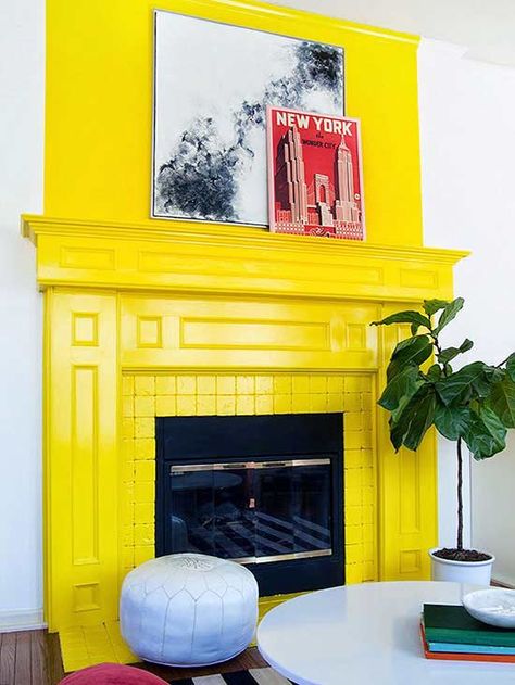 Bright yellow adds instant pop and polish to what could have otherwise been just another fireplace, and creates a focal point in this living room. Painted Fireplace, Paint Fireplace, Old Fireplace, Neon Decor, Colourful Living Room, Trendy Bedroom, Fireplace Makeover, Fireplace Mantle, Fireplace Surrounds