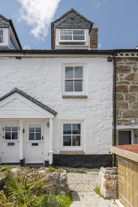 Sited in the picturesque fishing port of Mousehole, the Cornish property is located just a short walk away from the village bay and beachfront. The area also offers easy access to Cornwall's west coastline, as well as popular destinations such as Land's End, Sennen, and Newlyn. #dwell #homesforsale #realestate #cornwall Cornish Cottage, Fishermans Cottage, Cornwall Coast, Timber Staircase, Log Burning Stoves, Inglenook Fireplace, Modern Extension, Modern Appliances, Appartement Design