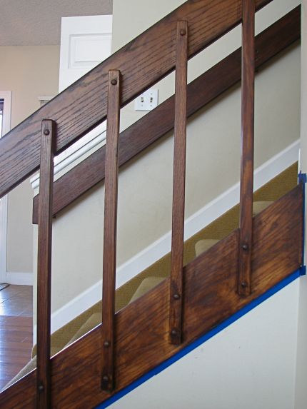 After one coat of stain Banister Remodel, 80s House, Split Foyer, Foyer Staircase, Stair Rail, Brown Doors, Oak Trim, Staircase Remodel, Staircase Makeover