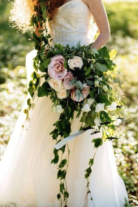 Organic wedding bouquets with cascading ivy cuttings and dark green leaves #weddings #weddingideas #weddinginspiration #greenweddings #weddingflowers Holding A Bouquet Of Flowers, Greenery Wedding Bouquet, The Lady Of Shalott, Holding A Bouquet, Enchanted Forest Wedding, Flowers And Greenery, Enchanted Wedding, A Bouquet Of Flowers, Cascade Bouquet