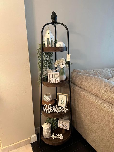 4 Tier Stand Decor, Tier Shelf Decor Living Rooms, Home Decor Display Ideas, Year Round Home Decor, Four Tier Shelf Decor, Standing Shelf Decor Living Room, How To Decorate A 4 Tier Shelf, Corner Shelf Decor Living Room, Hobby Lobby Tiered Shelf Decor