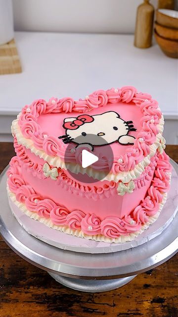 Josephine Casey on Instagram: "Hello kitty 🐱   So excited I finally got to make a hello kitty cake !! No one has asked me for one before but luckily it was my friends birthday and I finally got the request 🥳   I used an acetate sheet to make a transfer, I used piping tips, 125, 843, 70 . I used a mould to create the chocolate bows, and finished it off with some glitter spray. Everything I used is from @nycake, piping bags, molds, sprinkles and scraper etc   What character should I make next ?   #hellokitty #cake #cakedecorating" Homemade Hello Kitty Cake, Easy Hello Kitty Cake, Hello Kitty Cakes Ideas, Diy Hello Kitty Cake, Hello Kitty Cakes Birthday, Hello Kitty Birthday Cake Ideas, Hello Kitty Sheet Cake, Hello Kitty Birthday Party Ideas Cake, Hello Kitty Cake Ideas