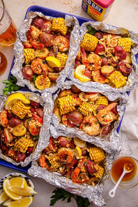 Easy Cajun Shrimp Boil Foil Packs (Oven or Grill!) Shrimp Boil In Oven, Easy Cajun Shrimp, Shrimp Boil Foil Packs, Cajun Shrimp Boil, Shrimp Grilled, Shrimp Boil Foil, Potatoes And Corn, Shrimp Boil Recipe, Easy Cajun