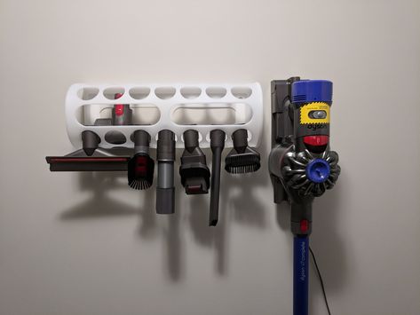 This $2 plastic bag holder from Ikea makes a great Dyson tools holder Ikea Plastic Bag Holder Ideas, Vacuum Attachment Storage Ideas, Stick Vacuum Storage, Dyson Organizer, Dyson Organization, Dyson Storage Ideas, Dyson Vacuum Storage, Dyson Vacuum Storage Ideas, Dyson Storage