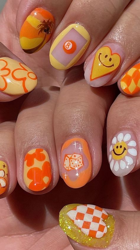 A close-up of a hand with almond-shaped nails, detailed with a creative mix of solid peachy orange, patterned, and striped designs, embellished with tiny rhinestones. Nail Ideas Orange, Festival Nail Ideas, Orange Nail Ideas, Bold Nail Art, Sunshine Nails, Nail Ideas For Summer, Orange Nail Designs, Orange Nail, Cute Nail Art Designs