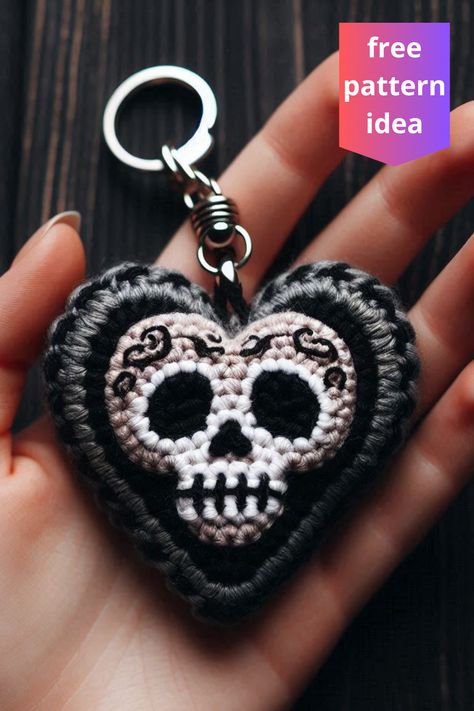 This black crochet skull heart keychain is an edgy, handmade accessory featuring intricate embroidery and a striking skull motif. Crochet Skull Motif, Crochet Keychain Holder, Crochet Skull Patterns Free, Crochet Keychain Ideas, Skull Crochet, Crochet Skull Patterns, Skull Ideas, Metal Crochet, Keychain Pattern