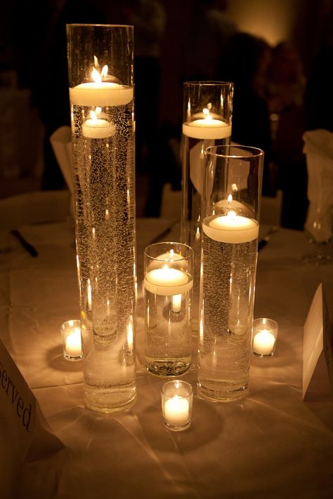 Candles In Water Centerpieces, Winter Wedding Floating Candles, Wedding Candle Float, Floating Candle Wedding Decor, Floating Candle Cocktail Table, Candle Floating In Water, Vase With Flower And Floating Candle, Floating Votive Candles, Gold Floating Candles