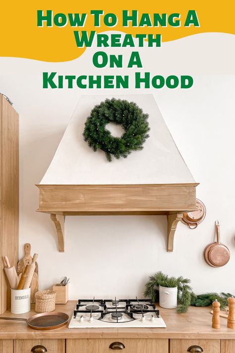 One of the most unique ways to display a wreath is in the kitchen, on your kitchen hood. Doing so can dramatically up the bonafide holiday vibes of your kitchen decor. ... . #range #rangehood #christmas #xmas #wreath #christmasdecorating #christmastime #kitchendecor #kitchen #festive Wreath On Kitchen Hood, Wreath On Oven Hood, Range Hood Wreath, Wreath On Stove Hood, Christmas Wreath Above Stove, Wreath Over Stove Vent Hood, Kitchen Hood Christmas Decor, Range Hood Christmas Decor, Wreath On Range Hood