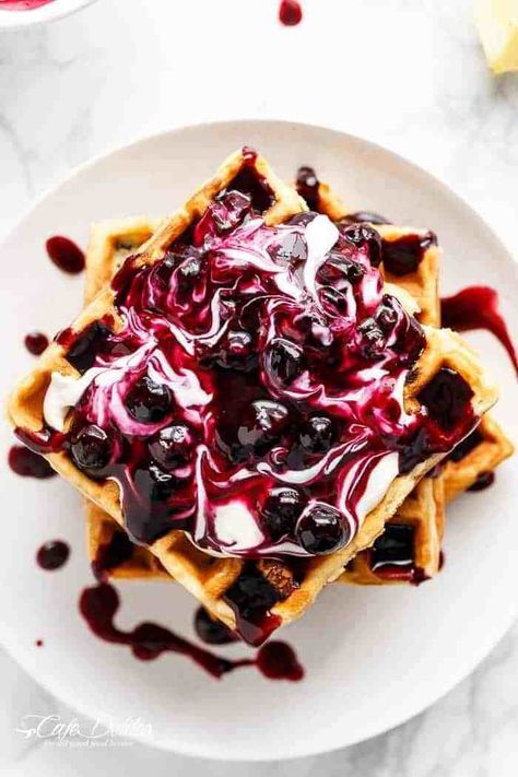 Blueberry Lemon Cheesecake Waffles bursting with blueberries in every bite, served with a creamy cheesecake toping and fresh home-made Blueberry Sauce! Cheesecake Waffles, Blueberry Lemon Cheesecake, Waffle Iron Recipes, Fro Yo, Cafe Delites, Blueberry Sauce, Slow Cooker Desserts, Pure Vanilla, Lemon Cheesecake