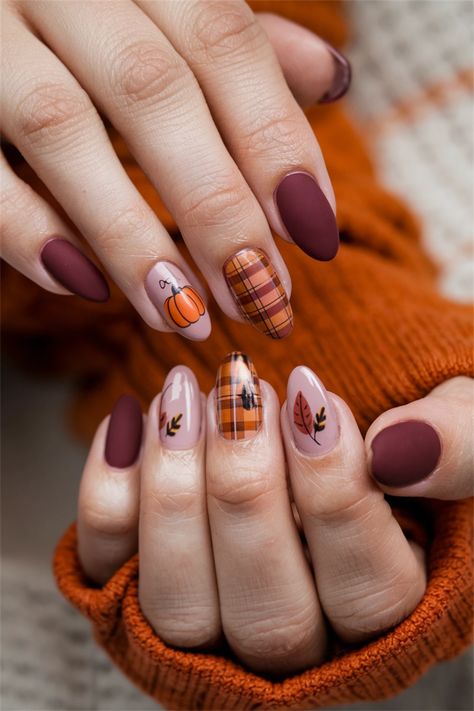 Embrace the cozy vibes of Fall with these adorable nail art designs that celebrate the beauty of autumn! Picture your nails adorned with warm tones of burnt orange, deep reds, and golden yellows, featuring charming leaf patterns or tiny pumpkins. These cute nail ideas are perfect for showcasing your seasonal spirit while adding a playful twist to your look. Get inspired and bring the essence of Fall to your fingertips! Fall Nails Ideas Pumpkin, Nail Art With Pumpkins, Round Autumn Nails, Fall Nails Pattern, Autumn Color Nails Fall, Thanksgiving Nail Designs Almond, Red Nails Fall Design, Short Nail Designs October, Cozy Nails Aesthetic