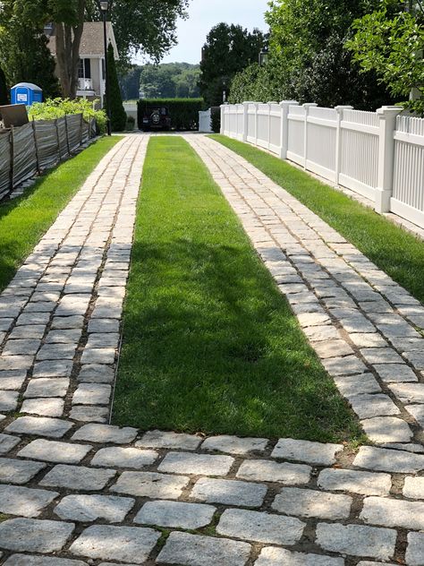 Beautiful and exceptionally done cobble stone and grass driveway in Essex, Connecticut. Brick Grass Driveway, Stone And Grass Driveway, Two Track Driveway, Concrete Grass Driveway, Concrete And Turf Driveway, Uphill Driveway Ideas, Driveway With Grass In Between, Modern Driveway Landscaping, Grass Driveway Ideas