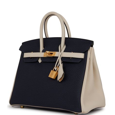 This Birkin is in Bleu Nuit and Craie togo leather with gold hardware and tonal stitching, front flap, two straps with center toggle closure, clochette with lock and two keys, and double rolled handles.The interior is lined with Craie chevre and has one zip pocket with an Hermes engraved zipper pull and an open pocket on the opposite side. Collection: ZOrigin: FranceCondition: New and never worn (plastic on hardware)Accompanied by: Hermes box, Hermes dustbag, clochette, lock, two keys, clochette Birkin Colors, Birkin Bag Collection, Gold Har, Hermes Special Order, Hermes Birkin 25, Hermes Box, Togo Leather, Fancy Bags, Birkin 25