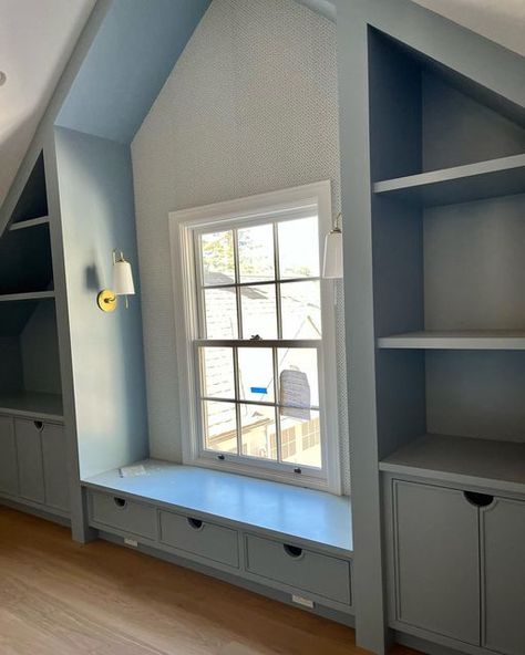 Finished Attic Living Room, Bonus Room Bookcases, Attic Accent Wall Ideas, Under Eaves Playroom, Angled Upstairs Bedroom, Attic Bedroom Ideas Wallpaper, Bookshelf In Attic Room, Playroom With Sloped Ceiling, Window Seat Slanted Ceiling