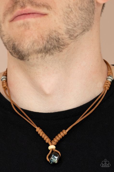 An earthy wooden bead and glassy faceted accent are knotted in place at the bottom of shiny brown cording that wraps around the neck for an earthy inspiration. Features a button loop closure. Sold as one individual necklace. Diy Men Necklace, 2024 Accessories, Afrocentric Jewelry, Paparazzi Accessories Jewelry, Mens Beaded Necklaces, Boho Men, Brown Necklace, Men Jewelry, Paparazzi Accessories