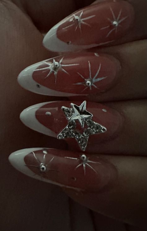 White French Tip Nails With Planet Charm, French Tip Acrylic Nails With Planet Charms, Star Gem Nails, Nails With Star Charms, Star Nails Acrylic Y2k Almond, Christmas Y2k Nails, Y2k Christmas Nails, Y2k Style Silver Star Jewelry, Black And White Star Nails Acrylic Y2k