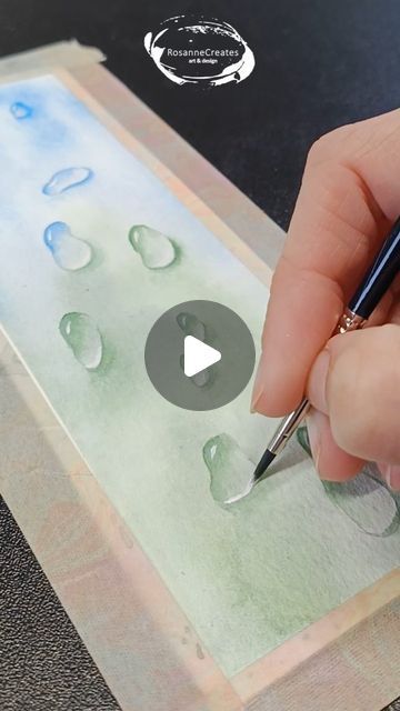 Watercolor tutorials and affordable art ❤️ on Instagram: "Trying out raindrops for the first time! How do you think I did? . . Paper: Baohong coldpressed Paints: Qor & Van Gogh Brushes: Silver Black Velvet . . #watercolorraindrops #raindropspainting #watercolorwaterdrops #waterdropspainting #droplet #dropletpainting #watercolorbookmark #bookmarkpainting #bookmarkart #simplewatercolor #simplewatercolorpainting #easywatercolors #watercolorfun #artvideo #watercolor #watercolorvideo #aquarela #waterverf #aquarelle #watercolortutorial" Watercolor Dropper Art, How To Paint Water Drops In Watercolor, Watercolor Water Droplets, Watercolor Water Drops, Watercolor Bubbles Tutorials, Watercolor Stained Glass Painting, Raindrop Watercolor, Watercolor Bubbles Painting, How To Paint Rain