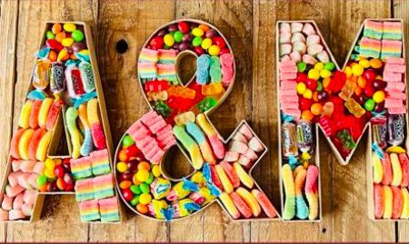 Sweet Charcuterie Letter, Cardboard Letters Filled With Candy, Food In Letter Boxes, Candy Charcuterie Letters, Number Candy Charcuterie Board, Candy Letter Charcuterie Board, Dessert Charcuterie Letters, Letter Shaped Charcuterie Board, Letter Charcuterie Board Diy